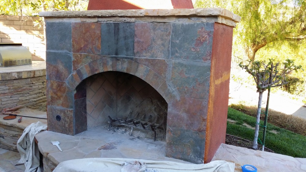 Finished re-tiling a fireplace